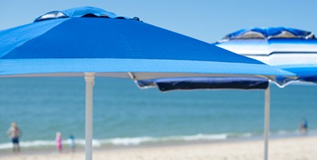 View of Umbrellas in the Sand by the Ocean at South Beach