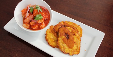 View of Colorful Equadorian Shrimp Seviche with Sauce Accompaniment on a White Plate at The Dunes Restaurant