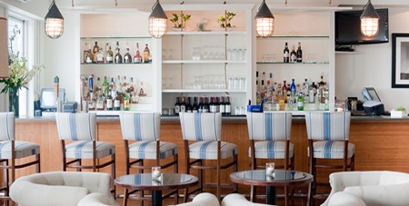 View of Seating and Liquors at The Dunes Bar & Lounge