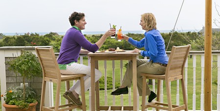 Kevin & Lizzie Enjoying Drinks Outside on The Dunes Deck