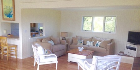 View of Chairs, Table & Couch in Living Room of Mattakesett Private Home South Beach 9