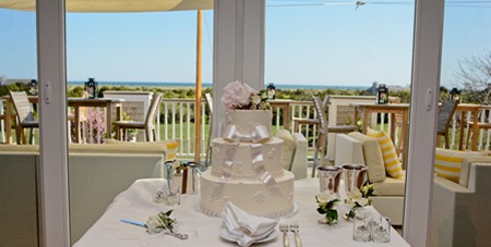 View of Wedding Cake on a Table at The Dunes With a View of South Beach