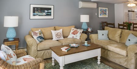 View of Couch, Table & Chairs in Living Room of Mattakesett Townhouse B1