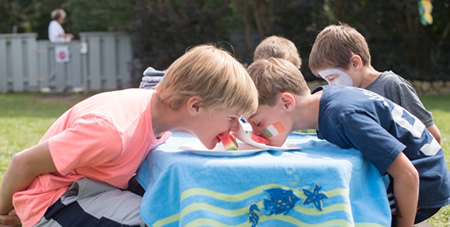 Boys Competing in a Watermelon Eating Contest Without Using Their Hands in the Children's Day Program at the Winnetu on Martha's Vineyard