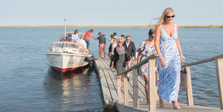 People Stepping Off the Water Taxi & Onto the Dock from the Water Taxi from Edgartown to The Dunes