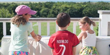 Kids Hanging Out on a Couch Looking at South Beach on the Outdoor Dunes Restaurant Terrace at the Winnetu
