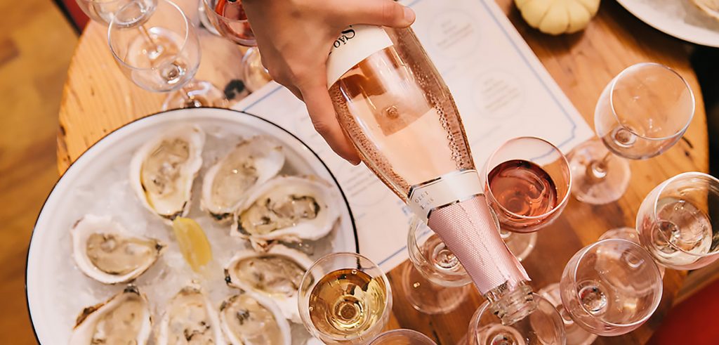 View of Oysters on the Half Shell & Rose Wine Being Poured Into Wine Glasses at the Martha's Vineyard Food & Wine Festival