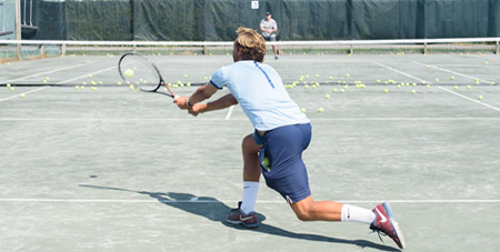 Two Men Playing a Tennis Match at the Winnetu Oceanside Resort on Martha's Vineyard